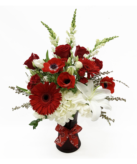 red and white flowers in vase