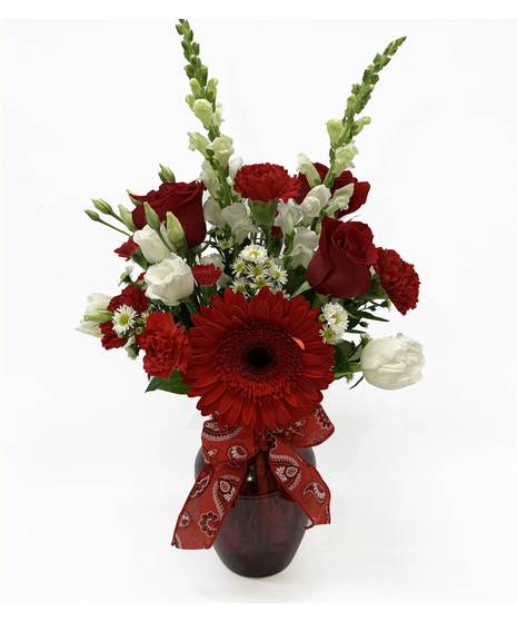 red and white flowers in vase