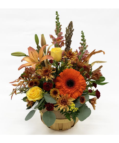 fall toned flowers in basket